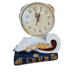 Ceas de masă decorativ din polirășină, model carte și pană, 20 × 20 cm, multicolor