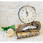 Ceas de masă decorativ din polirășină, model carte și pană, 20 × 20 cm, multicolor